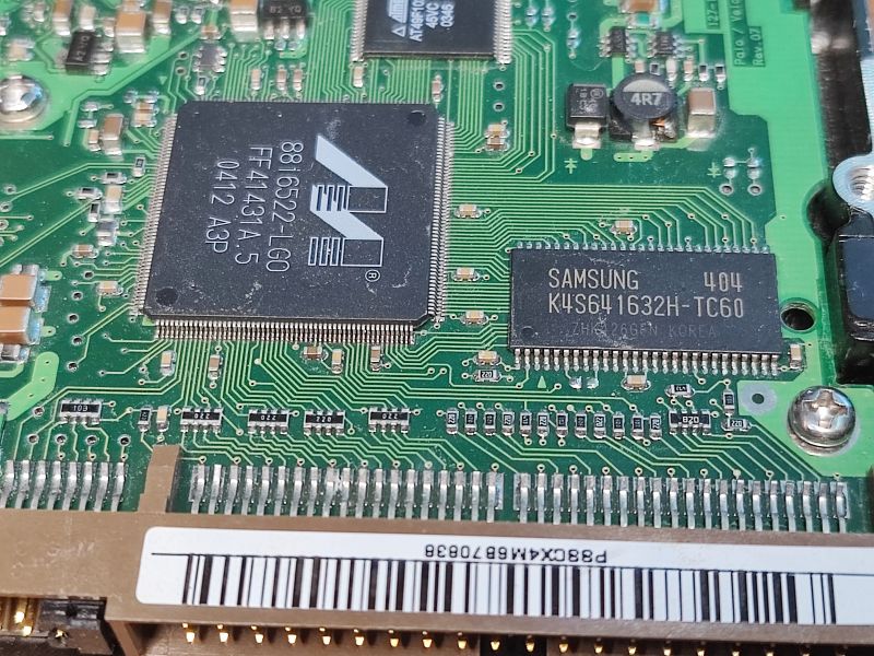 HDD Circuit Board with Integrated Circuits Close-up of a HDD circuit board with visible integrated circuits.