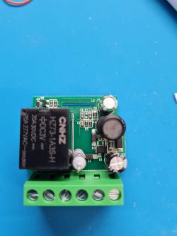 Electronic module with components on a blue background.