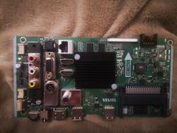 Vestel-Mainboard mit verschiedenen Anschlüssen auf einem Stoffhintergrund.