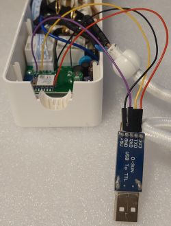 Power Strip Interior with USB to TTL Interface Interior of a power strip with a connected USB to TTL interface.