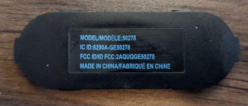 Black label on an electronic device with model and country of manufacture information.
