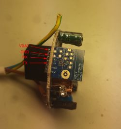 WB2S module with VBAT, GND, RX, and TX pins labeled on a disassembled smartplug