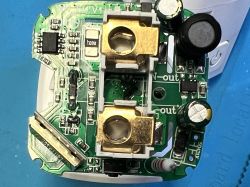 Inside of XT-BL02 plug showing PCB with electronic components and power terminals