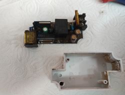 Rusty Electronic Relay after Water Ingress Image of a rusty electronic relay interior on a paper towel.