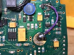 Close-up of a metal detector's PCB with visible repair.