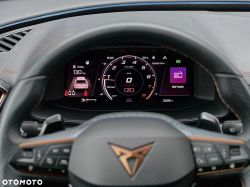Driver’s view of a car’s digital instrument cluster with speed at 0 km/h and a “RMF MAXX” media tile