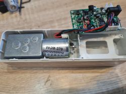 Interior of AVATTO Device with Motor and Circuit Board Open casing with motor and circuit board inside.