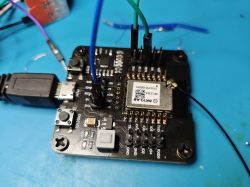 Development board with SkyLab GPS module connected via jumper wires and USB.