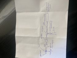 Odręczny schemat instalacji hydraulicznej na kartce, z opisami zaworów, trójnika i pompy.