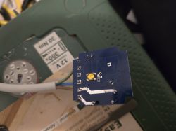 Mini smart switch PCB with hidden T34 pins.