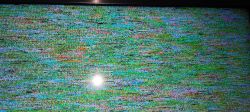 TV screen displaying colorful interference with dots.
