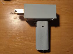Prototype of a battery-powered soldering iron on a table