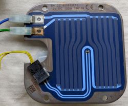 Metal plate with blue heating trace and connectors; yellow, green, and blue wires visible