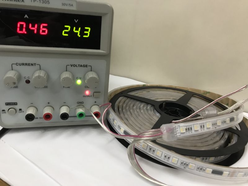 Wiring of RGBW LED Strip with TM512 Controller Close-up of RGBW LED strip with five wires labeled for power, data, and RS485 communication.