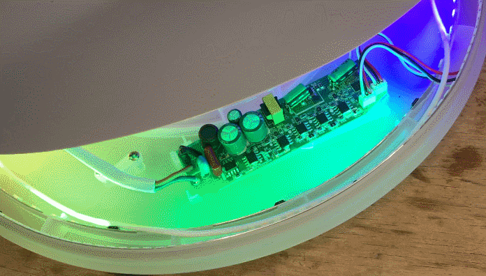 Interior of LED Lamp with Colorful Lighting Close-up of the inside of a circular LED lamp with colorful lighting.