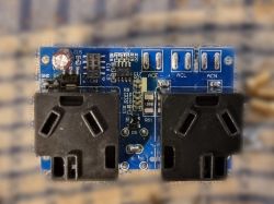 Energy measurement module with AC sockets on PCB Electronic module with AC sockets and components mounted on a blue PCB