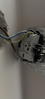 Close-up of an electrical box with wires.