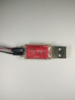 USB to TTL CP2102 converter with attached cables.
