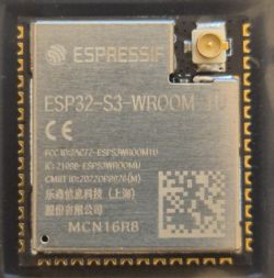 ESP32-S3-WROOM-1U module with Espressif logo and certification details on casing.