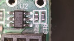 Close-up of an A6E1 LPS chip labeled U2 next to SMD components R21 and R13 on a PCB