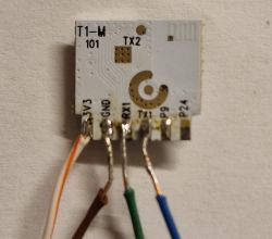 Small PCB with soldered wires and pin labels 3V3, GND, RX1, TX1, P9, P24