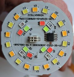 Close-up of a round LED board with multicolored diodes.