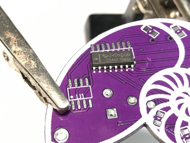 CD4017BM Integrated Circuit on Purple Board PCB board with a CD4017BM integrated circuit on a purple background.