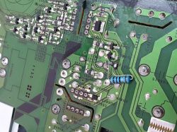 Close-up of a circuit board with a color-coded resistor visible.