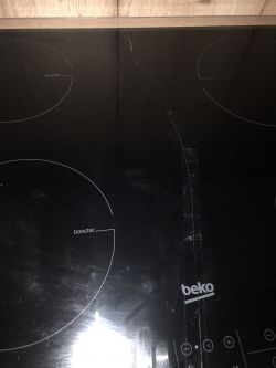 Indukcja Beko HII64205 - pęknięte szkło, możliwość zabezpieczenia, ryzyko zwarcia