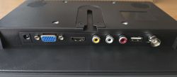 Rear connector panel: power, VGA, HDMI, RCA AV, audio, USB, and antenna jack