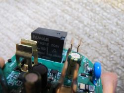 Interior of Tuya BSD29 Plug Close-up of the internal electronics of the Tuya BSD29 plug showing a FANHAR module and capacitors.