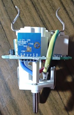 Electronic circuit board with visible cables and RX, TX labels.