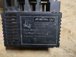Zbliżenie na kontroler JR1801RX-12V z widocznymi specyfikacjami technicznymi.