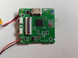 Electronic circuit board Printed circuit board with electronic components and connected wires.