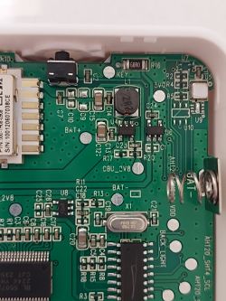 Close-up of electronic components on the circuit board of a sensor.