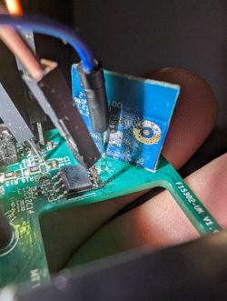 Close-up of a circuit board with soldered wires.