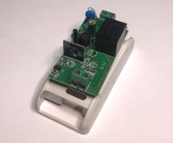 Circuit Board of ATLO-B1-Tuya WiFi Relay Printed circuit board with electronic components of a WiFi relay on a white background.