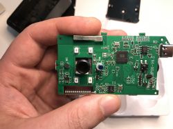 Circuit board with camera module held in hand