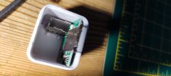 Opened Micro USB Switch with Circuit Board Opened micro smart USB switch with visible circuit board and components.
