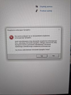 Komunikat błędu sterownika Synaptics na ekranie komputera.