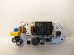 Circuit Board with ZK QYT73 Relay Circuit board with electronic components, including ZK QYT73 relay and capacitors.