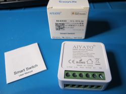 Aiyato BRK-HW1KN1 smart switch and packaging on a blue background.