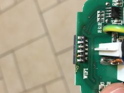 Close-up of a circuit board with a port labeled WiFi and a pin header.