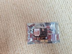 Smart IoT Device for PCI-Express x1 Small IoT device in an anti-static bag on a beige background.