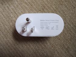 MOES US Matter Smart Plug MOES US Matter smart plug on a light background with printed specifications.