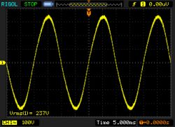 Sine Wave Signal on Oscilloscope Yellow sine wave signal graph on a RIGOL oscilloscope.
