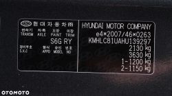 Hyundai car nameplate with VIN number and other details.