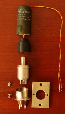 Disassembled Bristol Microverter electromechanical switch on wooden surface