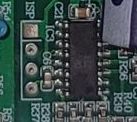 Circuit board with an integrated circuit and test pads.