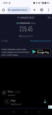 Wynik testu prędkości internetu, pokazujący pobieranie 215,45 Mbps i ping 33 ms.